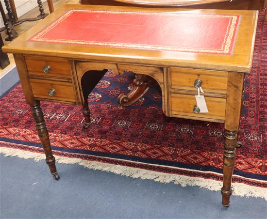 A late Victorian mahogany writing table, fitted four drawers W.91cm